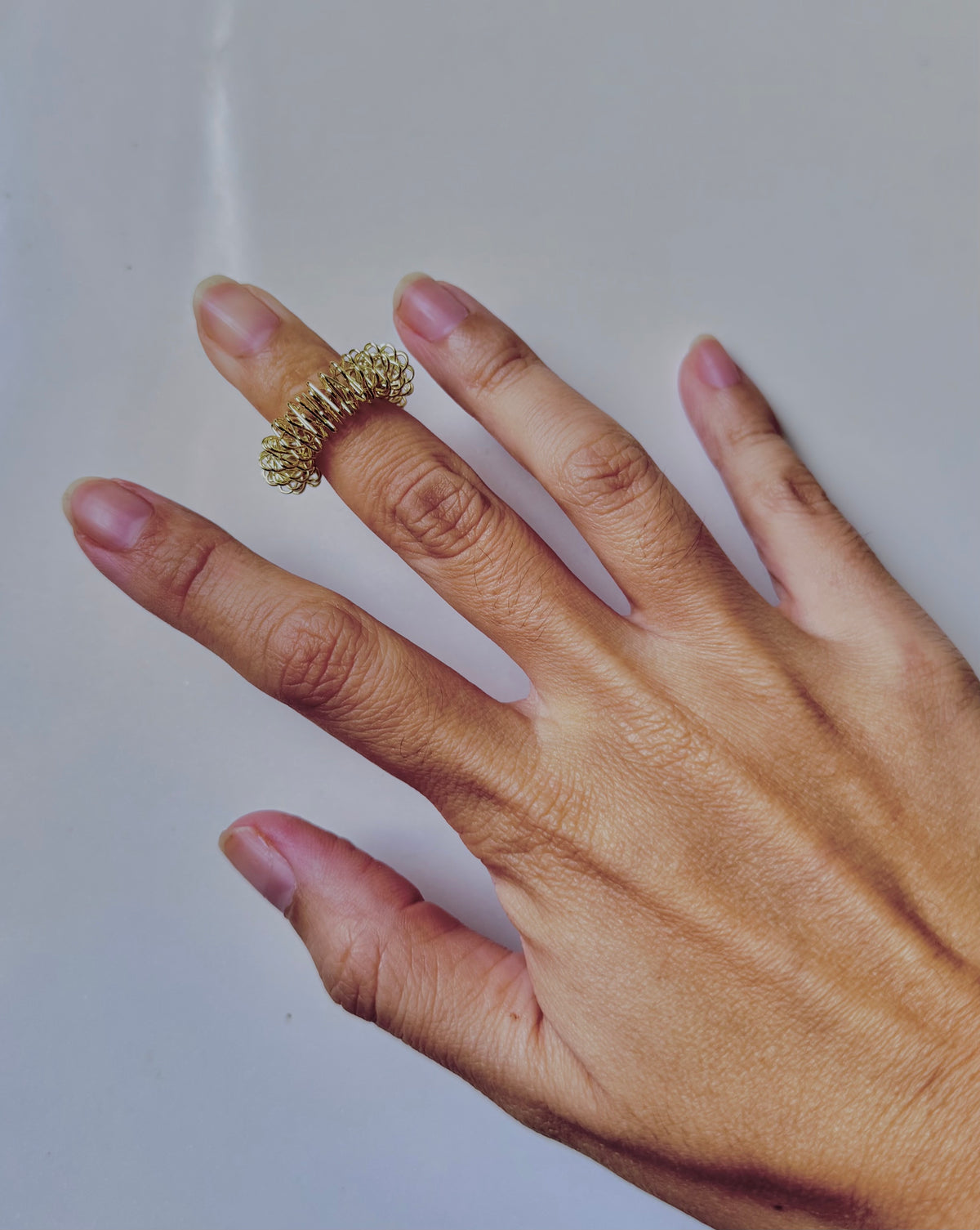 Spiky ring on adult hand